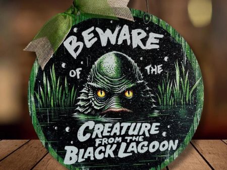 Beware of the Creature from the Black Lagoon round wood sign. For Discount